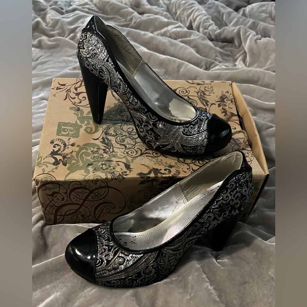 Silver and black heels